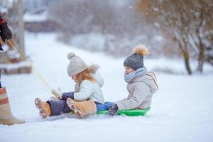 Family of dad and kids vacation on Christmas eve outdoors photo