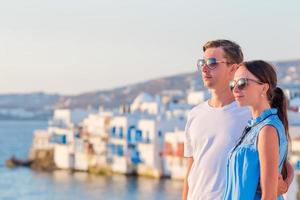 Family in Europe. Happy couple in Little Venice background on Mykonos Island, in Greece photo