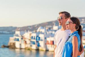 Family in Europe. Young couple on Little Venice background on Mykonos Island, in Greece photo