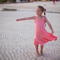 Adorable little girl on tropical beach vacation in Phillipines photo