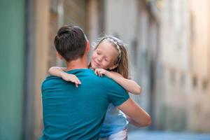 Happy father and little adorable girl in Rome during summer italian vacation photo