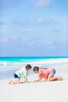 Adorable little girls during summer tropical vacation photo