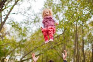 Young father with his cute little daughter have fun outdoor in the park photo