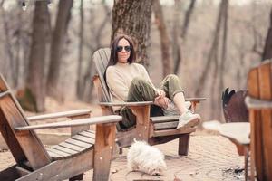 Woman relaxing in the forest on weekeend photo