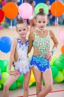 Little gymnast training on the carpet and ready for competitions photo