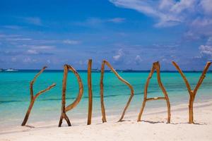 Friday made of wood on Boracay island background turquoise sea photo