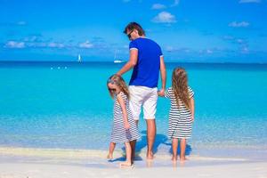 Father and little cute girls during tropical vacation photo