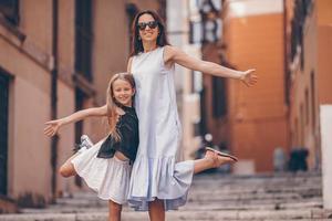 Happy mom and little adorable girl traveling in Rome, Italy photo