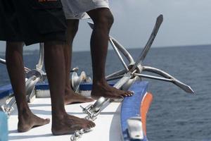 black man migrant feet detail no shoes photo