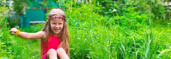 Little adorable girl during summer vacation photo