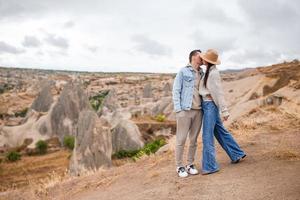 Happy couple on summer vacation in famous place. Cave formations. photo