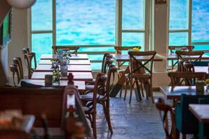 Summer empty openair cafe with beautiful view to the sea in popular area in Mykonos Little Venice photo