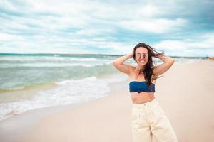 Young happy woman on the beach photo