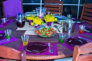 Beautiful home served table for dinner on the veranda photo