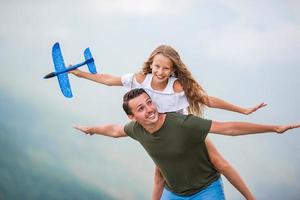 Beautiful happy family in mountains in the background of fog photo