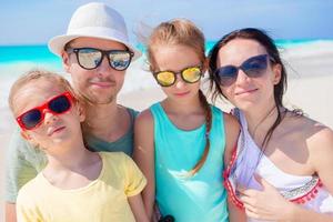 Beautiful family taking selfie portrait on the beach photo