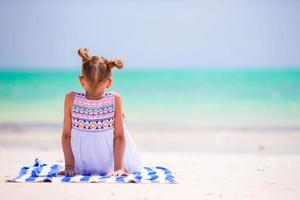 Adorable little girl enjoy beach summer vacation
