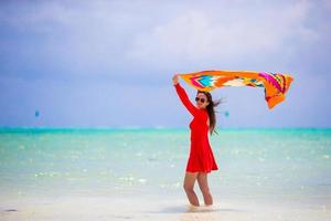 Beautiful young woman on the beach. Vacation outdoors leisure happiness joy fun wellness concept. Healthy active lifestyle vitality. photo