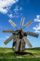 Wooden windmills in the village photo