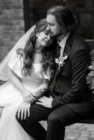 young couple bride and groom in a white dress photo