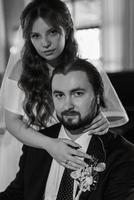 young couple bride and groom in a white dress photo