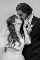 young couple bride and groom in a white dress photo