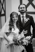 young couple bride and groom in a white dress photo