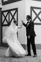 young couple bride and groom in a white dress photo