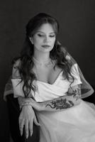 portrait of a bride girl with red hair in a white wedding dress photo