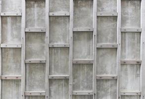 Cement wall - old cement concrete with wooden square decorate abstract design on wall background photo