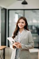 Modern business woman in the office with copy space photo