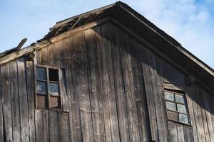 old wooden house with windows high in the sky photo