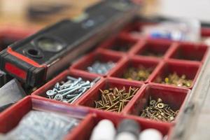 many different screws in the  organizer of master for work photo