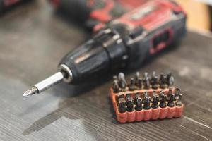 two electric screwdrivers or drills for screwing and drilling photo