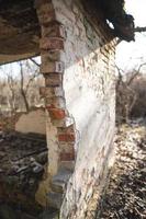 old ruined house, not suitable for living, fallen brick wall photo