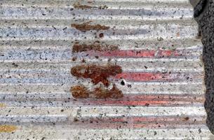 Close-up of an old rusty galvanized sheet. photo