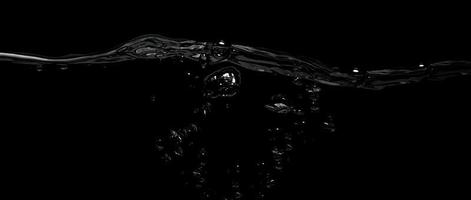 Liquid suface line between underwater and above water with black background. photo