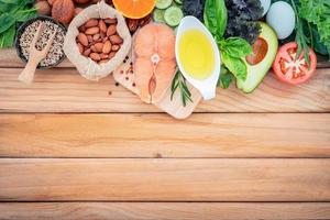 Ketogenic low carbs diet concept. Ingredients for the healthy foods selection  set up on wooden background photo