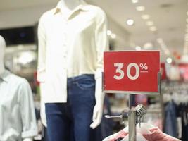 sale 30 off mock up advertise display frame setting over the clothes line in the shopping department store for shopping, business fashion and advertisement concept photo