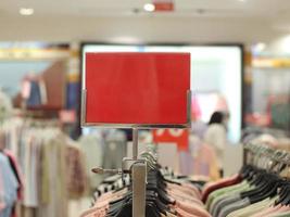 blank red board that can be used for a discount mockup at a sale of women's shoes and sandals photo