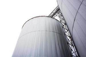 Silo Metal Sheet container settles on the ground with white background. photo