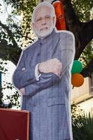 New Delhi, India - January 16 2023 - Prime Minister Narendra Modi cut out during BJP road show, the status of PM Modi while attending a big rally in the capital photo