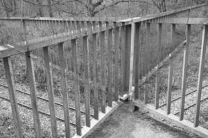 double exposure, crossing railings in black white photo