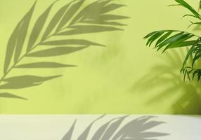 Green palm leaves with shadow on a green background. Empty stage for demonstration and advertising of cosmetic products photo