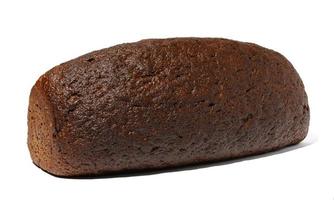 Baked rye flour bread in the shape of a brick on a white isolated background photo