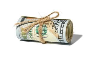 Rope tied roll of one hundred dollar bills isolated on white background photo