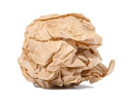 Crumpled brown sheet of paper isolated on white background photo
