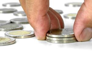 closeup male hand put coin stack to money,Saving money concept of business concept photo