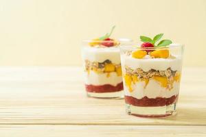 homemade mango and raspberry with yogurt and granola photo