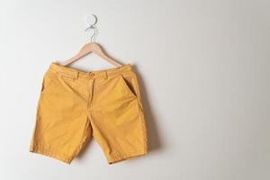 short pants hanging on wall photo